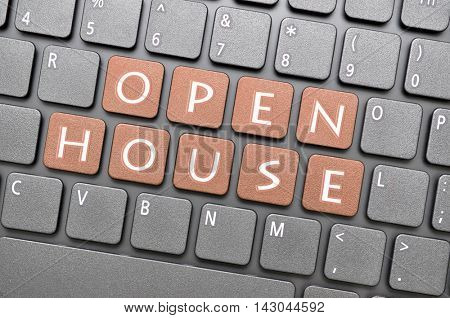 Gunmetal open house key on keyboard