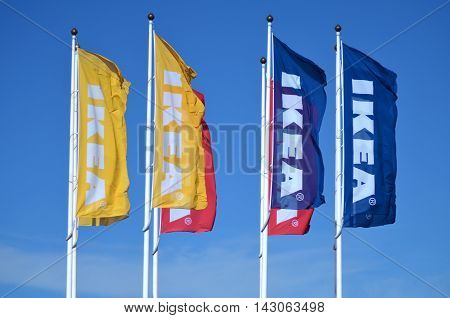 CIRCA AUGUST 2016 - GDANSK: logo of ikea on waving flags against blue sky. IKEA is multinational group of companies designing and selling ready-to-assamble furniture. It was founded in 1943 in Almhult, Sweden.