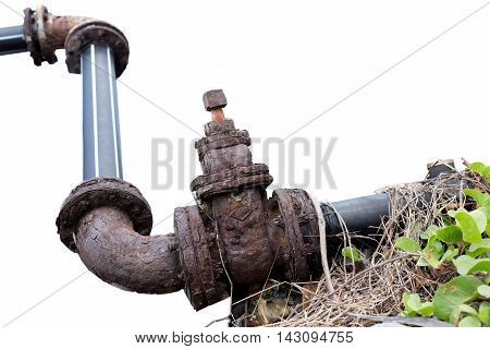 Old rusty industrial water pipe on rodeside isolated in white background