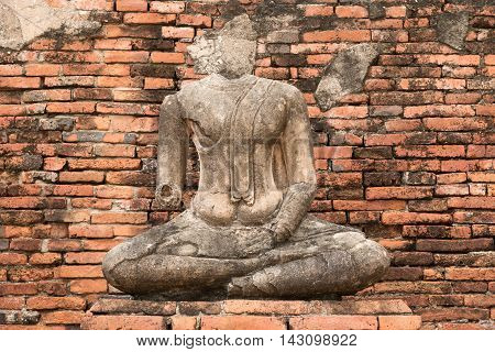 The remains of The old Buddha statue in Wat Chaiwatthanaram Thailand.