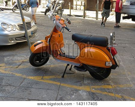 Orange Vespa Motorbike In Florence