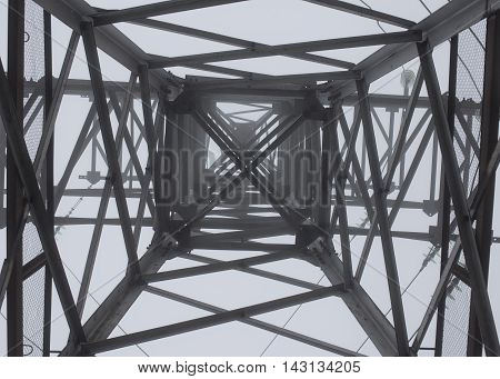 transmission tower silhouette in mist white background