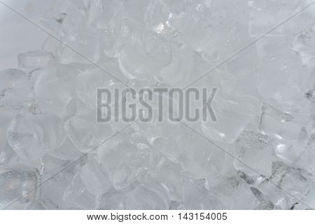 The texture of the ice cubes, frozen cubes of ice. Cocktail ice