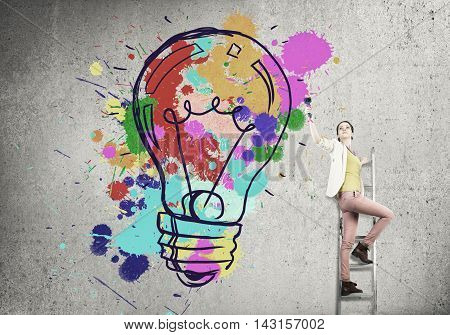 Young woman in casual drawing creativite idea concept on wall