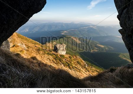 Beautiful stone on a slope. Mountain landscape. Sunny day in autumn. Carpathian mountains, Ukraine, Europe. Beautiful nature