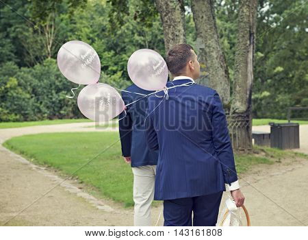 Man going in the street with balloons, birthday party