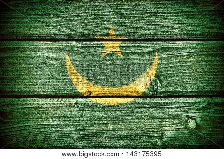 flag of Mauritania painted on old grungy wooden background: 3d illustration
