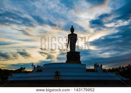 Sunset Over Walking Buddha Statue At Buddhamonthon (phutthamonthon), Buddhist Park In Nakhon Pathom,
