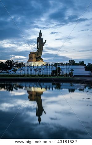 Walking Buddha Statue And Reflection On Water At Buddhamonthon (phutthamonthon), Buddhist Park In Na