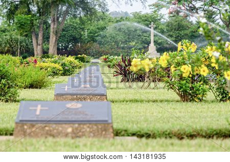 KANCHANABURI THAILAND - MAY 3 2014: Chungkai War Cemetery this is historical monuments where to respect prisoners of the World War 2 who rest in peace here MAY 3 2014 in Thailand