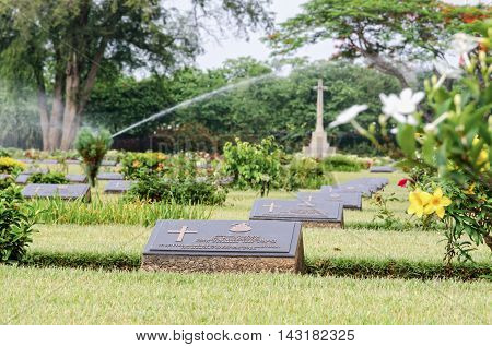 KANCHANABURI THAILAND - MAY 3 2014: Chungkai War Cemetery this is historical monuments where to respect prisoners of the World War 2 who rest in peace here MAY 3 2014 in Thailand