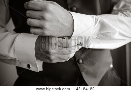 Men Wear A Shirt And Cufflinks
