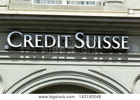 INTERLAKEN, SWITZERLAND - JUNE 5, 2016: Credit Suisse signboard over entrance of Credit Suisse office. Credit Suisse Group is a Swiss multinational financial services holding company, headquartered in Zurich, that operates the Credit Suisse Bank and other