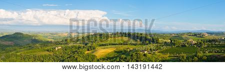 Wide panoramic landscape of surroundings of the medieval city of San Giminiano Tuscany Italy.
