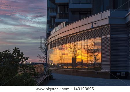 Disjointed reflections cloudy sunrise South Boston waterfront