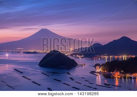 View of Mount Fuji with Suruga bay and Numazu town in twilight time