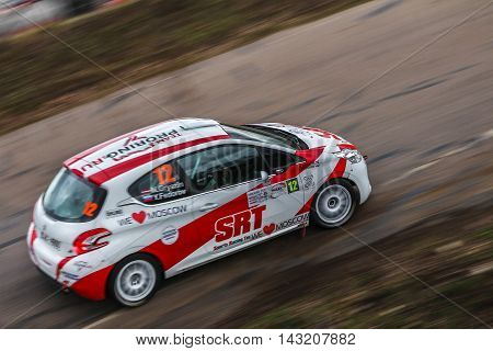 Moscow Russia - Apr 18 2015: Peugeot 208 R2 driver Gryazin Nikolay and co-driver Fedorov Yaroslav during the Rally Masters Show 2015 at the Krylatskoye District.