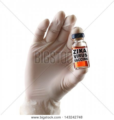 Zika virus danger concept. Hand in glove holding glass bottle with zika virus vaccine on white background, closeup.