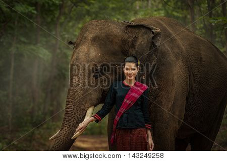 Closeup portrait of a beautiful girl with elephant.