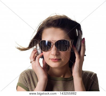 A girl in headphones smile on white background