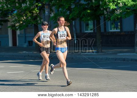 DNEPROPETROVSK, UKRAINE - MAY 09, 2013: Anastasiya Pisika (523) - the second place of the half marathon under-21 race at the city streets during Ukrainian opened athletics championship  Dnepropetrovsk, Ukraine at May 09, 2013