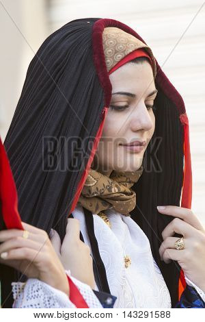 SELARGIUS, ITALY - September 14, 2014: Former marriage Selargino - Sardinia - portrait of a beautiful girl in traditional Sardinian costume