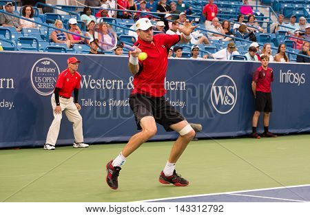 Mason Ohio - August 16 2016: John Isner in a match at the Western and Southern Open in Mason Ohio on August 16 2016.