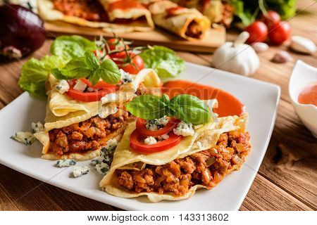 Stuffed Bolognese Pancakes With Minced Meat And Vegetable With Tomato Sauce