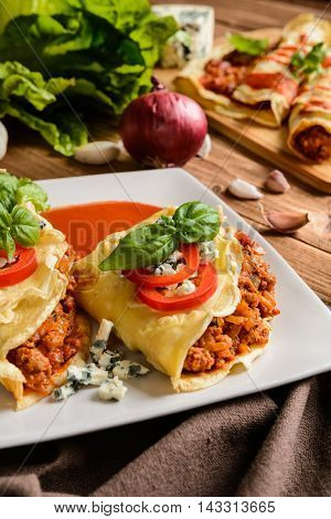 Stuffed Bolognese Pancakes With Minced Meat And Vegetable With Tomato Sauce