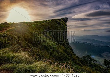 Sunrise scene with the peak of mountain and cloudscape at Phu chi fa in ChiangraiThailand