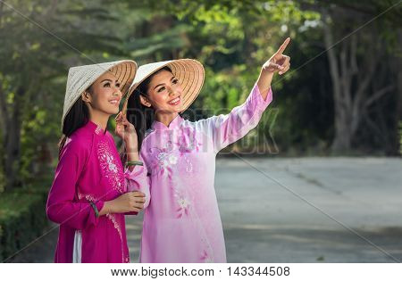 Portrait of Vietnamese girl traditional dress Ao dai is famous traditional costume for woman in Vietnam