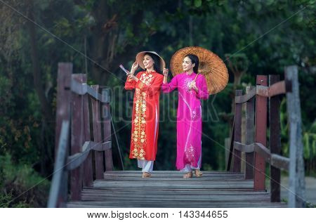 Portrait of Vietnamese girl traditional dress Ao dai is famous traditional costume for woman in Vietnam