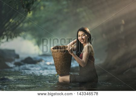 Asian sexy woman bathing in cascade Thailand