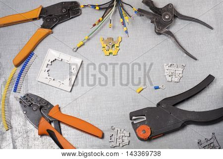 Set of electrical tool on wooden background. Accessories for engineering work, energy concept