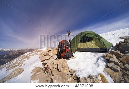 Camping on the top of the mountain in winter.