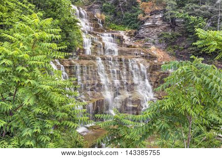 Ribbons of whitewater cascade down Hector Falls a roadside waterfall in New York's Finger Lakes Region.