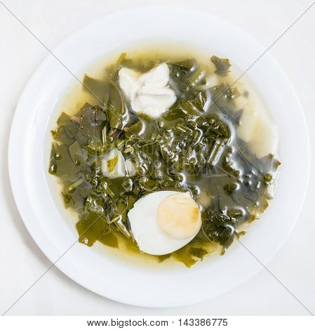 Above View Of Vegetarian Soup In Plate From Greens