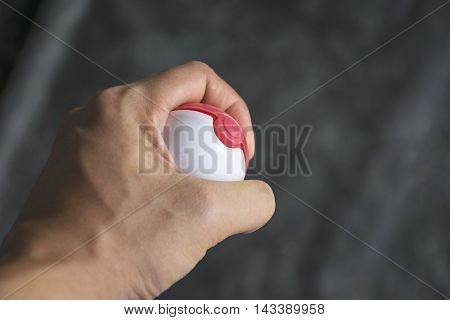 Thailand - August 20, 2016: Poke ball in Hand  (Pokemon Ball). Pokeball toy of the game Pokemon Go at Chon Buri, Thailand.