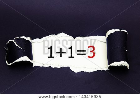 1+1=3 written under torn black paper.Business, technology, internet concept