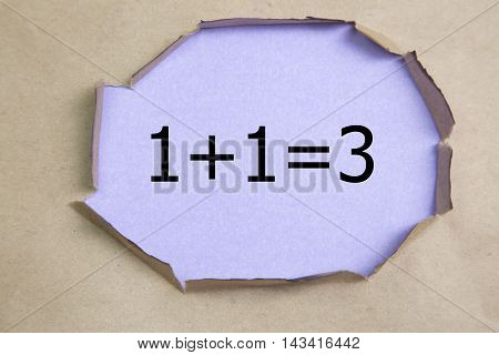 1+1=3 written under torn Brown paper.Business, technology, internet concept.