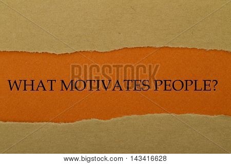 WHAT MOTIVATES PEOPLE? question written under torn paper.