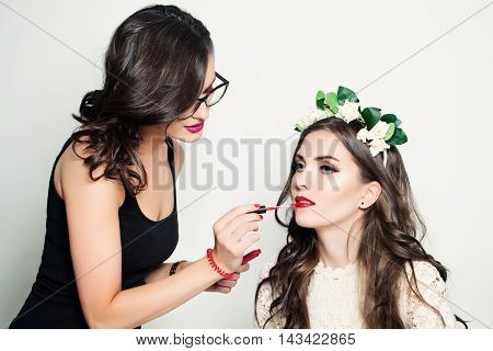two Beautiful Woman Make-up Artist. Stage Makeup