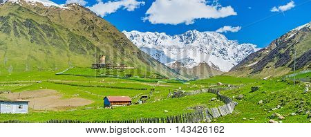 Lamaria Church on the green hill is the highest point of the highest settlement in Europe Ushguli Upper Svaneti Georgia.