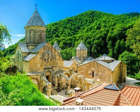 The white stone Haghartsin Monastery is hidden among the green forests in mountains of Tavush Province Armenia.