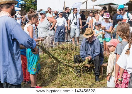 Men Manufacturing Rope In The Old-fashioned Way