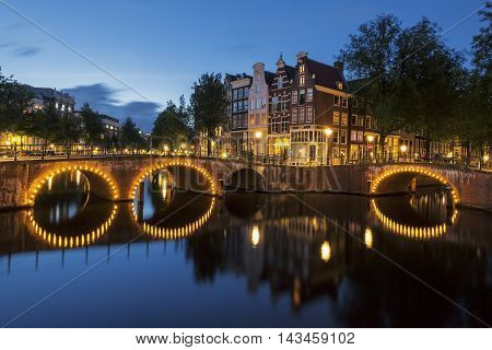View of Amsterdam Canal by night. Netherlands