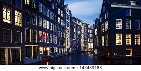 Famous view of Amsterdam at night Netherlands