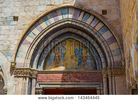 Mural in the tympanum of portico in the south facade of Basilica of Sant Feliu in Gerona. Costa Brava Catalonia Spain.