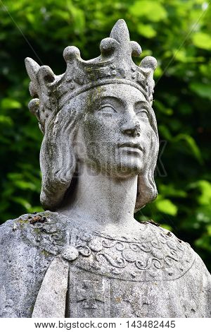 Poissy France - august 6 2016 : the statue of the king Saint Louis near the collegiate church