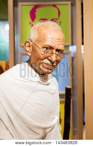 BANGKOK THAILAND - DECEMBER 19: Wax figure of the famous Mahatma Ghandi from Madame Tussauds on December 19 2015 in Bangkok Thailand.